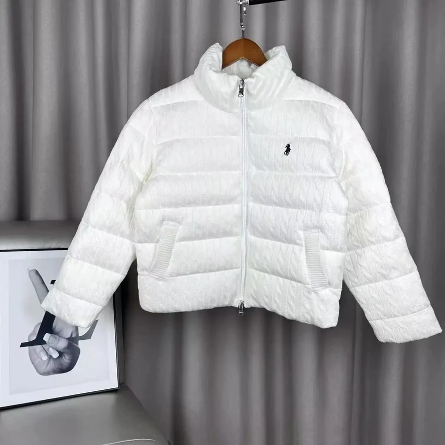 Short white quilted puffer jacket with a stand collar photographed on a hanger